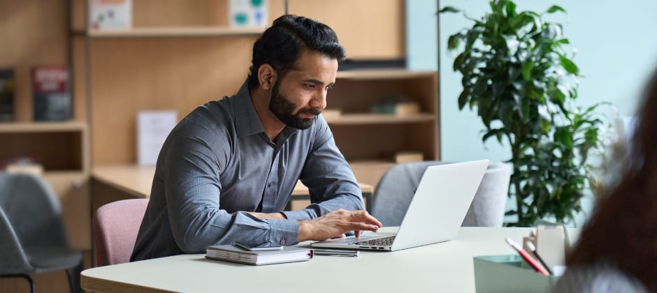 A student working on the laptop